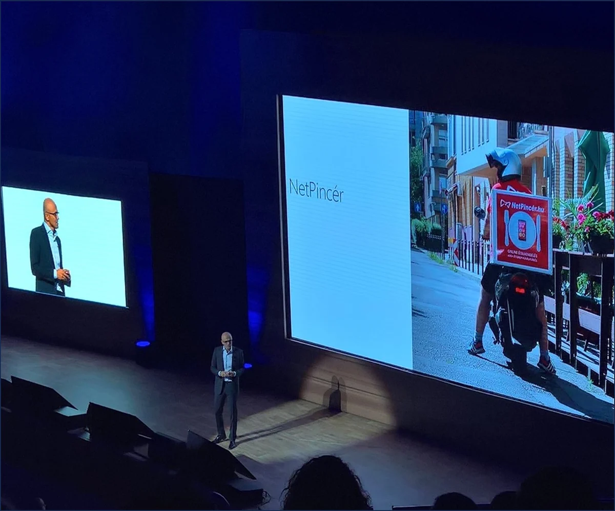 Satya Nadella on stage with a NetPincér presentation at Future Decoded in Hungary